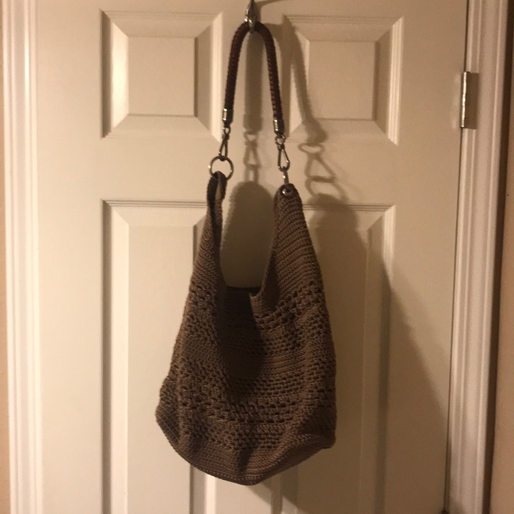 The Sak tan and brown colored hobo bag
